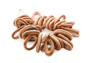 Photo of Bunch of delicious ring shaped Sushki (dry bagels) on white background