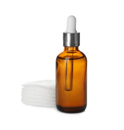 Photo of Cosmetic product and cotton pads for makeup removal on white background