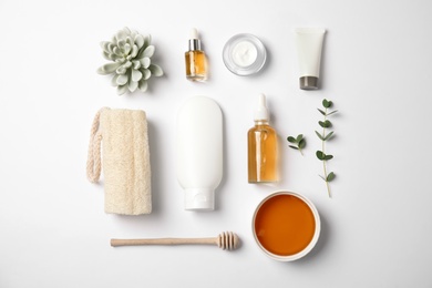 Photo of Flat lay composition with different body care products on white background