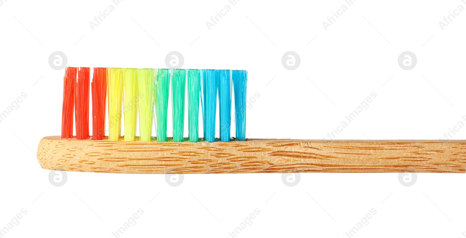 Photo of Toothbrush made of bamboo on white background, closeup