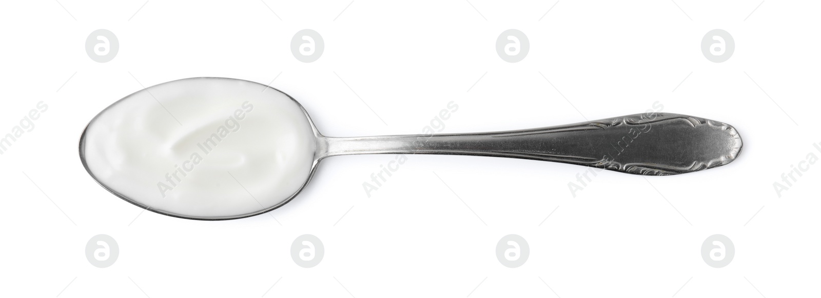 Photo of Delicious natural yogurt in spoon isolated on white, top view