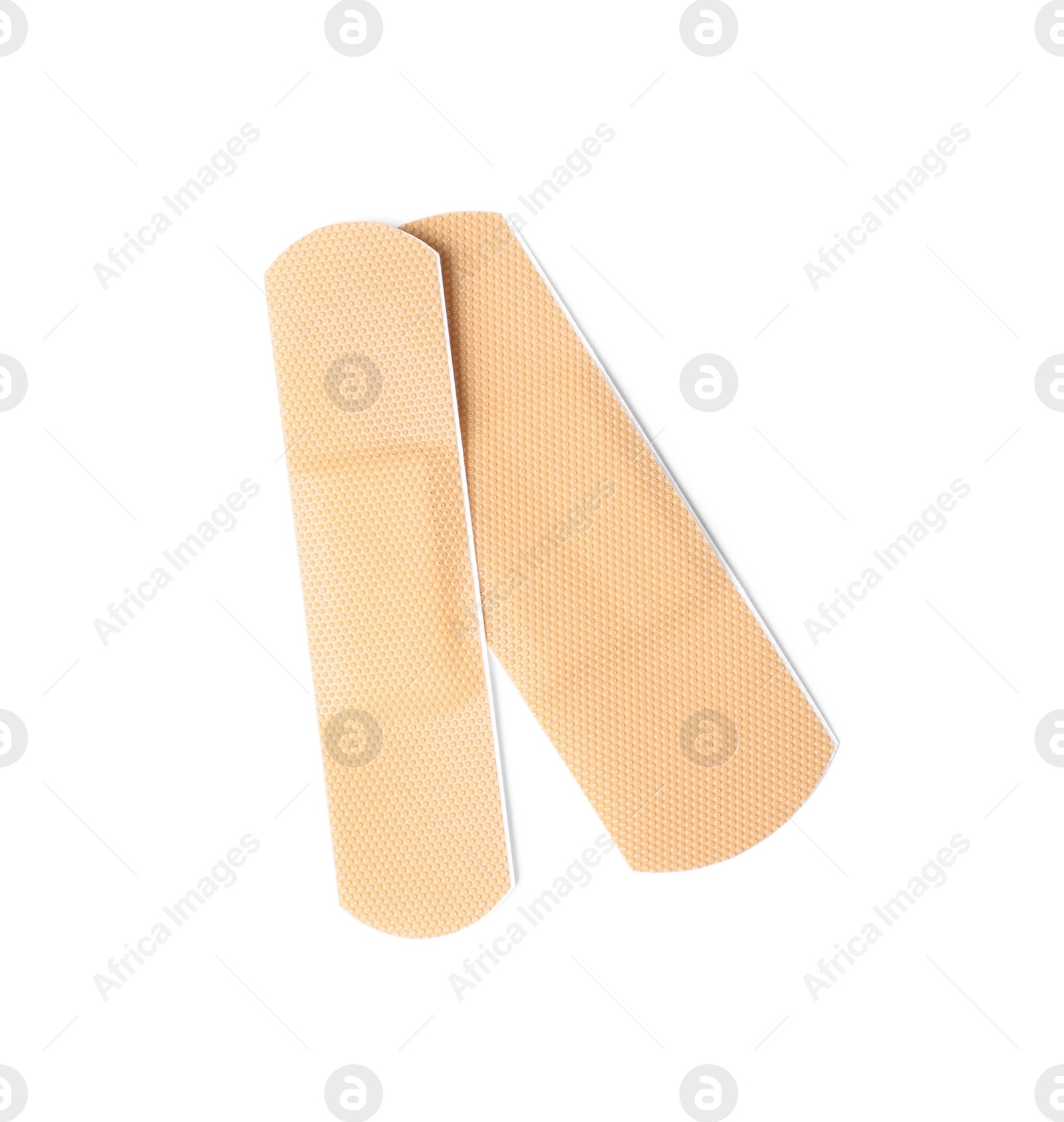 Medical sticking plasters isolated on white. First aid item Photo of Medical sticking plasters isolated on white. First aid item