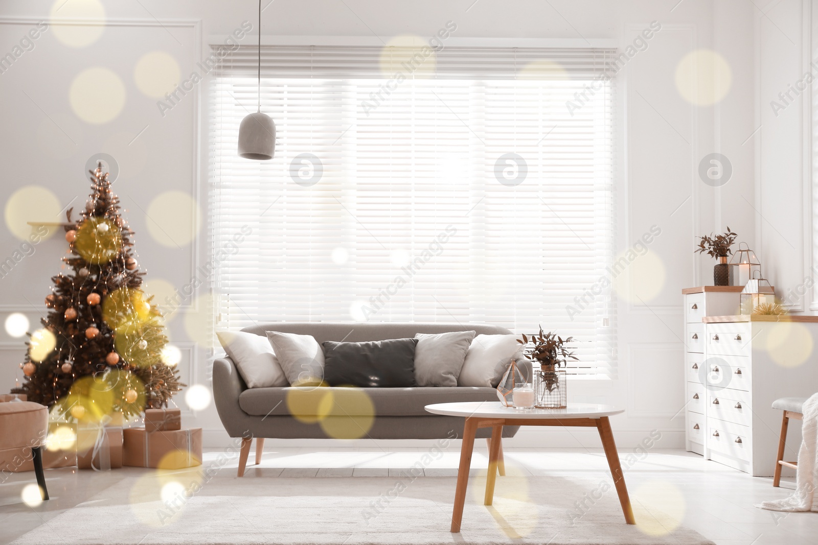 Image of Beautiful Christmas tree and sofa in contemporary living room. Interior design