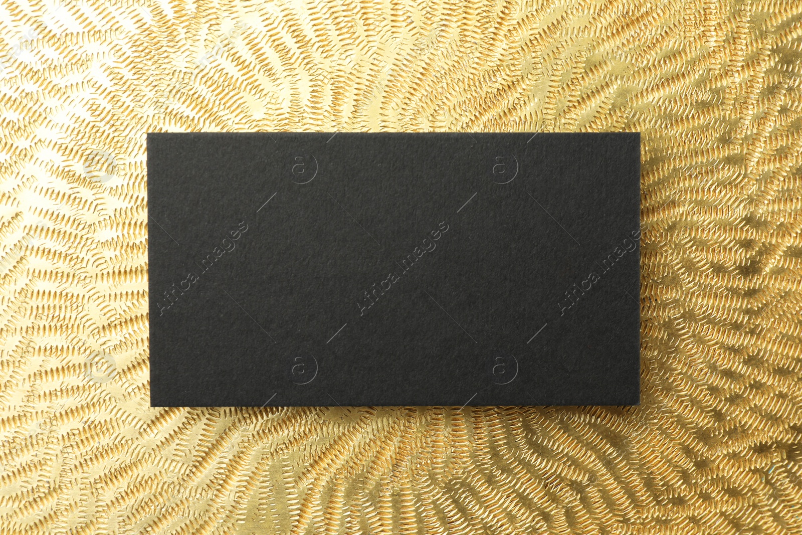 Photo of Blank business card on golden background, top view. Mockup for design