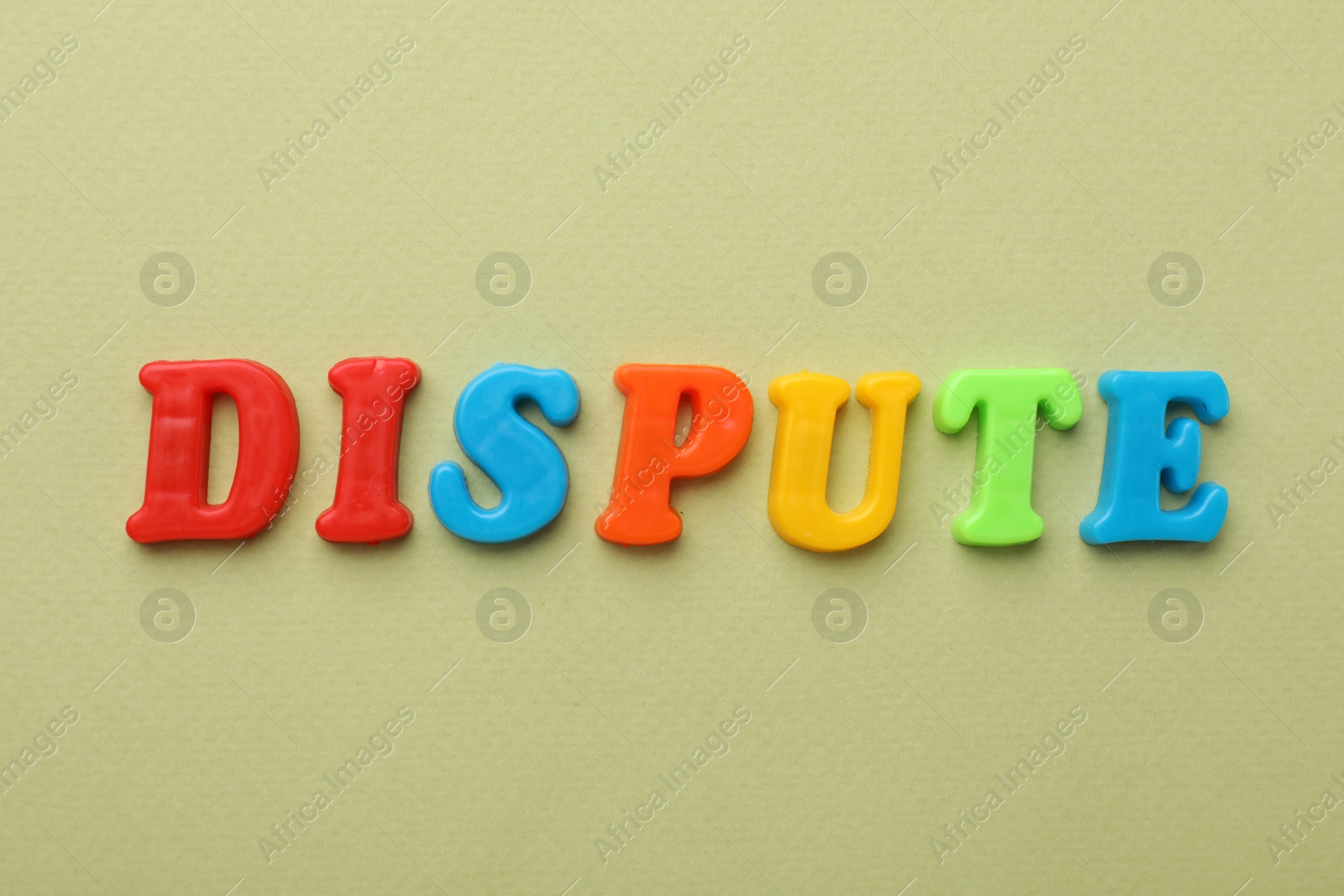 Photo of Word Dispute made of colorful letters on light green background, flat lay