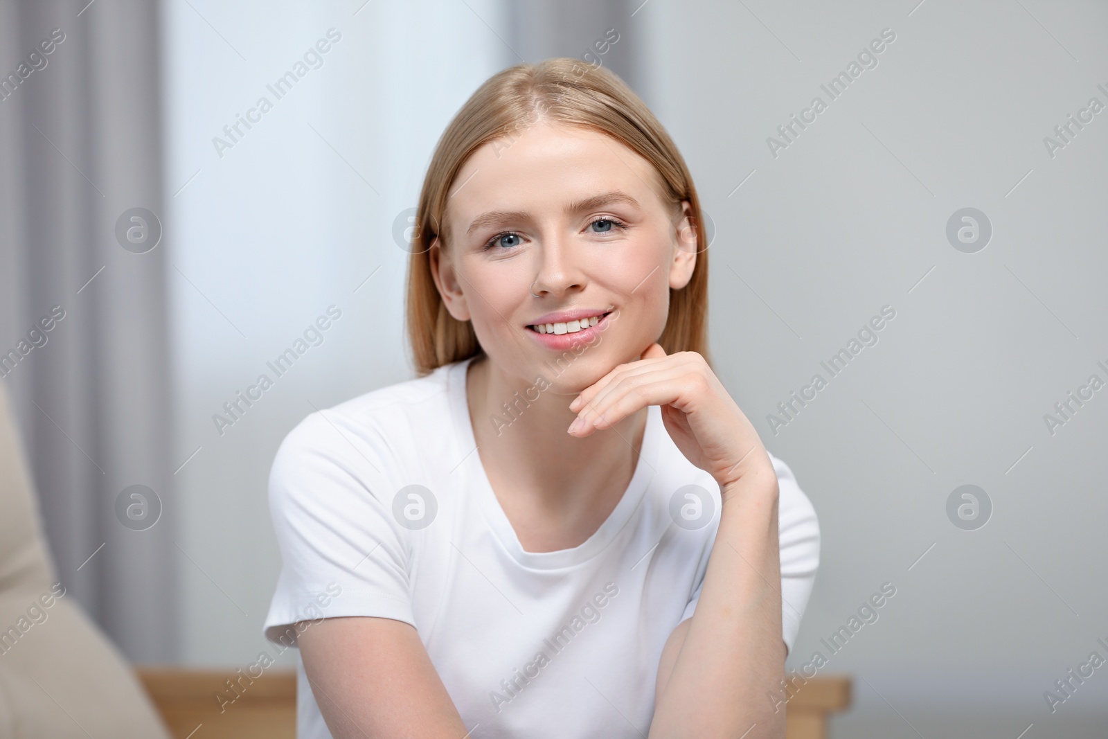 Photo of Portrait of beautiful young woman at home