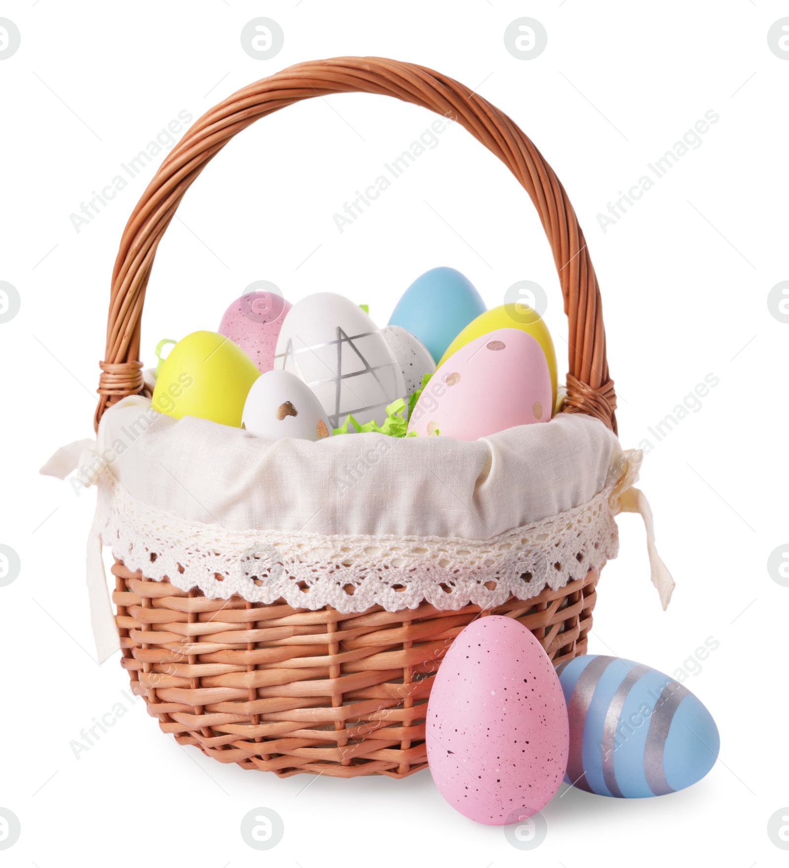 Photo of Wicker basket with beautifully painted Easter eggs isolated on white