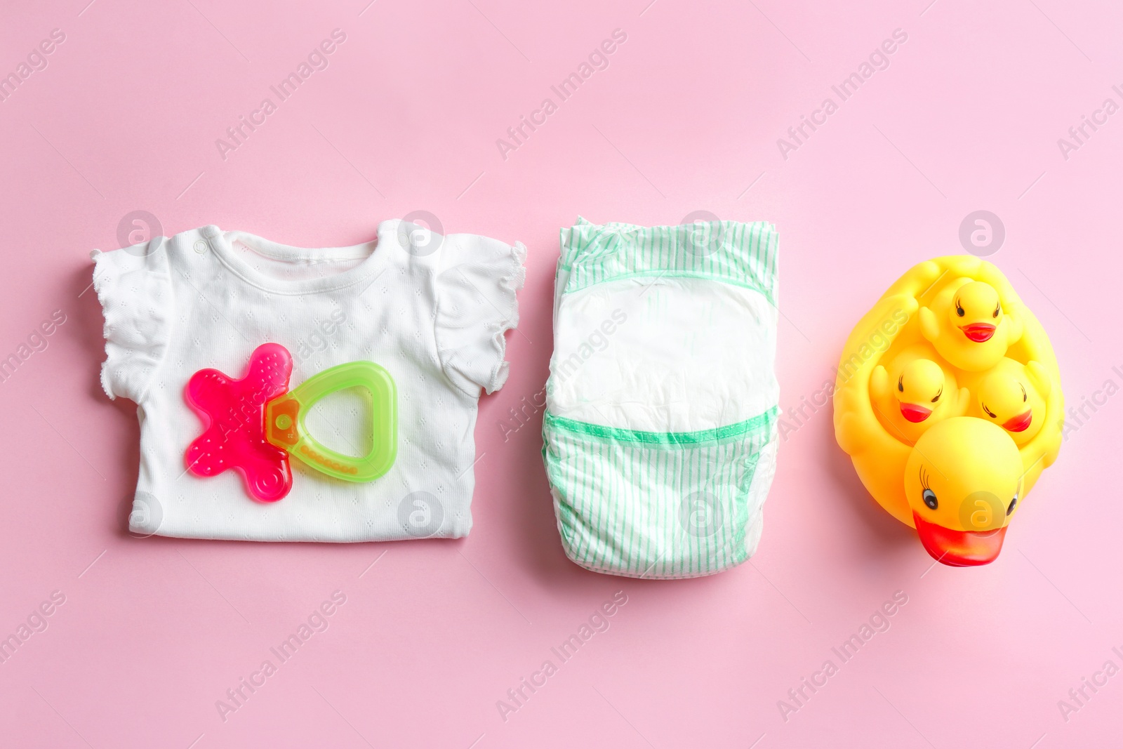 Photo of Flat lay composition with baby accessories on color background