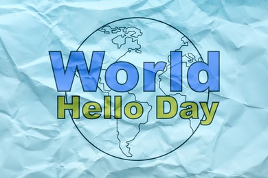 Phrase World Hello Day and image of Earth on crumpled light blue paper