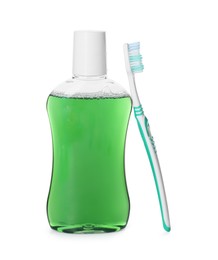 Bottle of mouthwash and toothbrush isolated on white