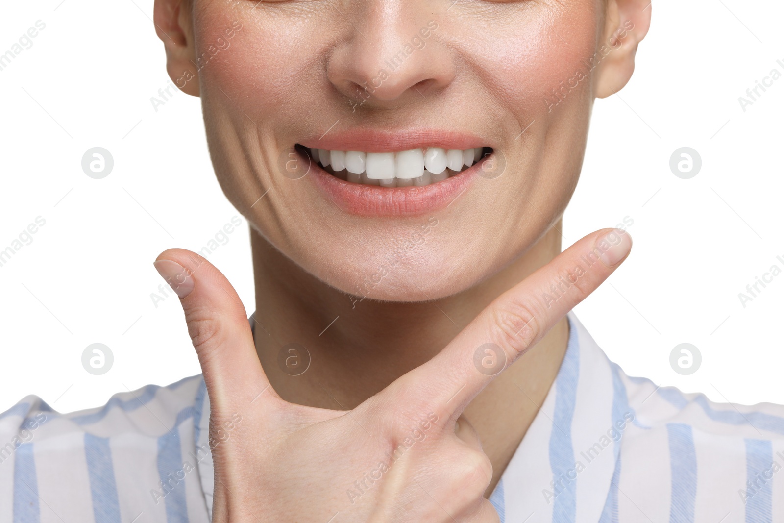 Photo of Woman showing her clean teeth and smiling on white background, closeup