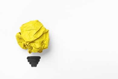 Idea concept. Light bulb made with crumpled paper and drawing on white background, top view. Space for text