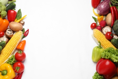 Frame of fresh vegetables on white background, flat lay. Space for text