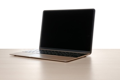 Modern laptop with blank screen on table against white background