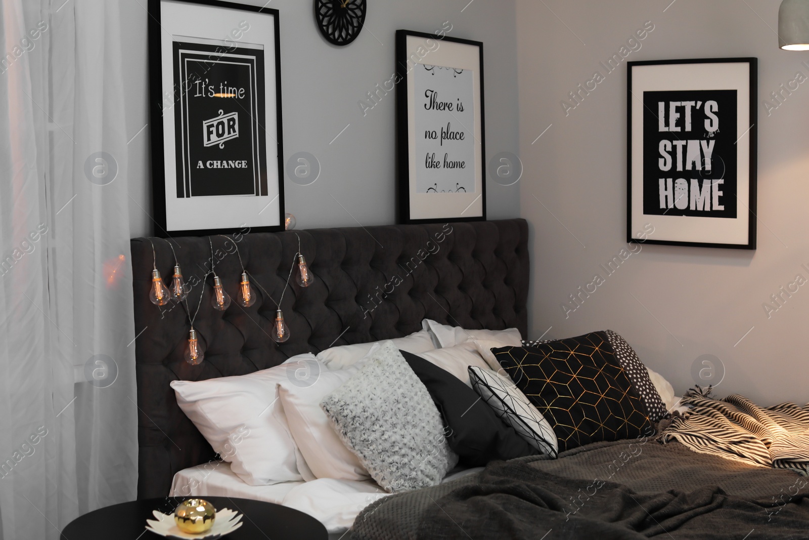 Photo of Comfortable bed with soft pillows indoors. Modern interior element