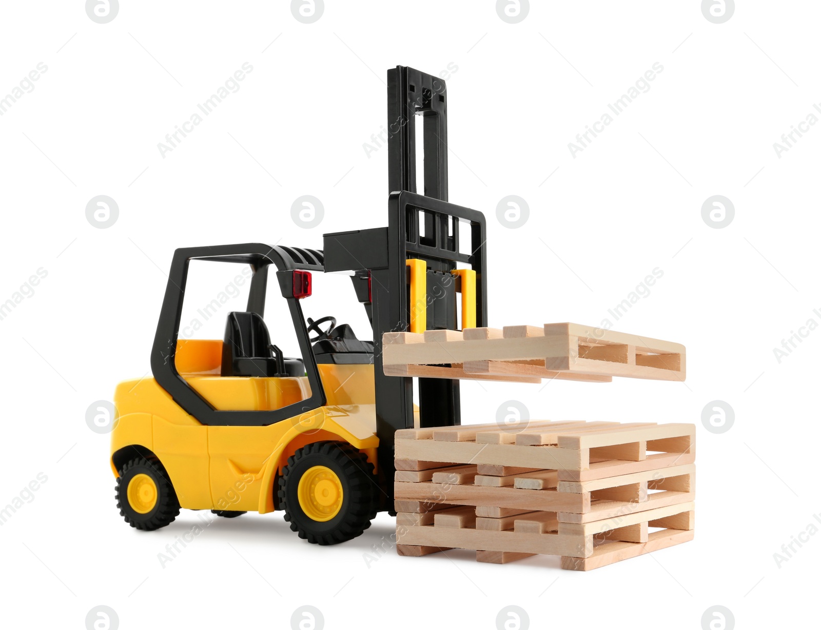 Photo of Toy forklift truck with wooden pallets on white background