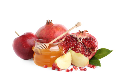 Photo of Honey, apples and pomegranate on white background. Rosh Hashanah holiday