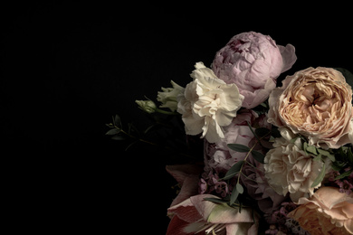 Beautiful bouquet of different flowers on black background, space for text. Floral card design with dark vintage effect