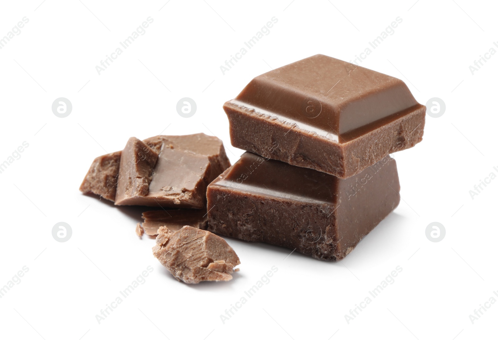 Photo of Pieces of delicious milk chocolate isolated on white