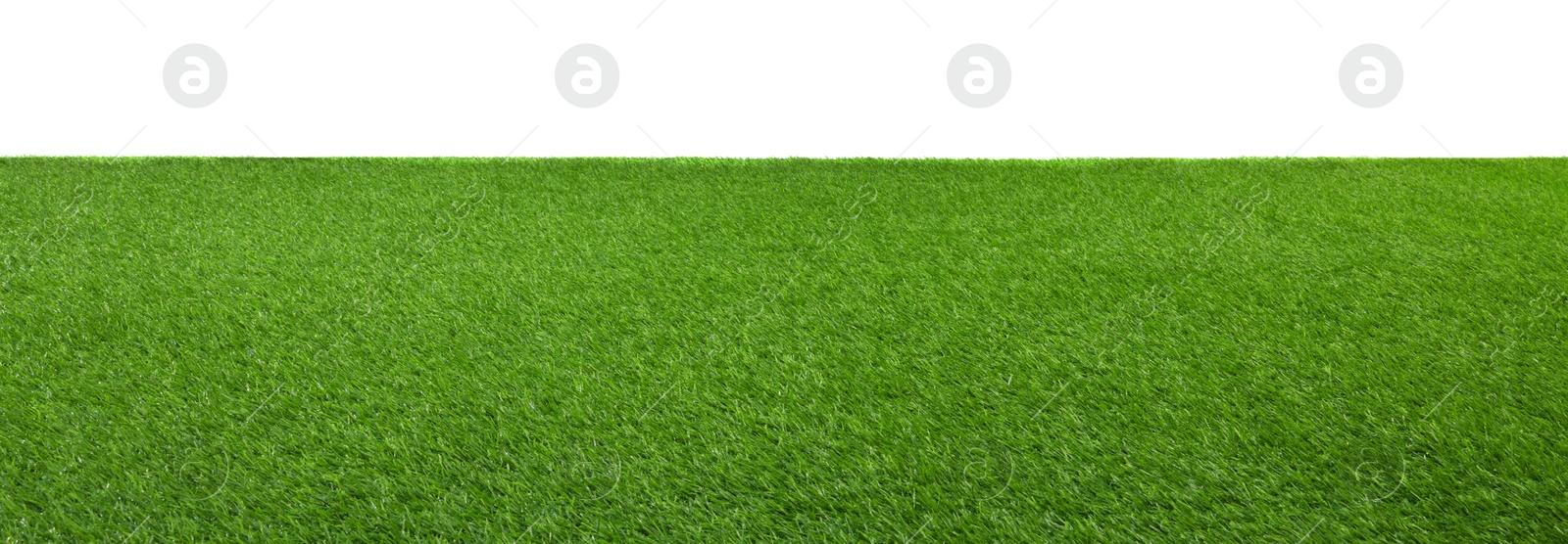 Photo of Green artificial grass surface isolated on white