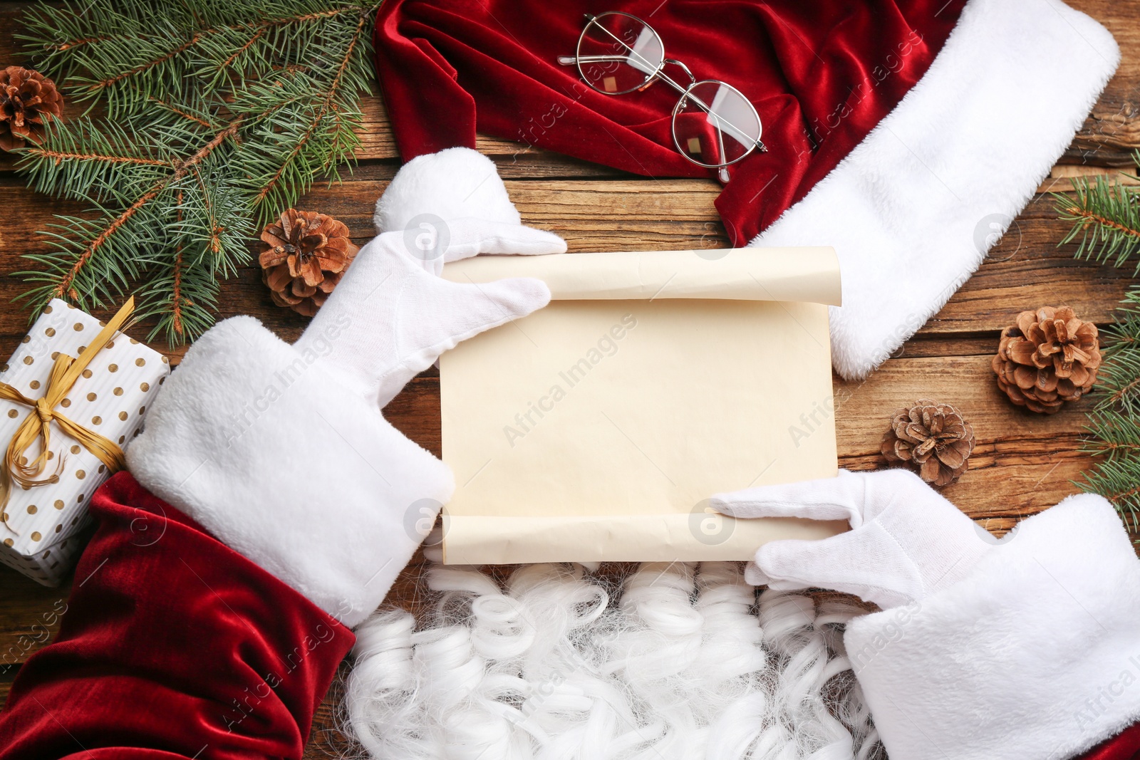 Photo of Santa with letter at wooden table, top view