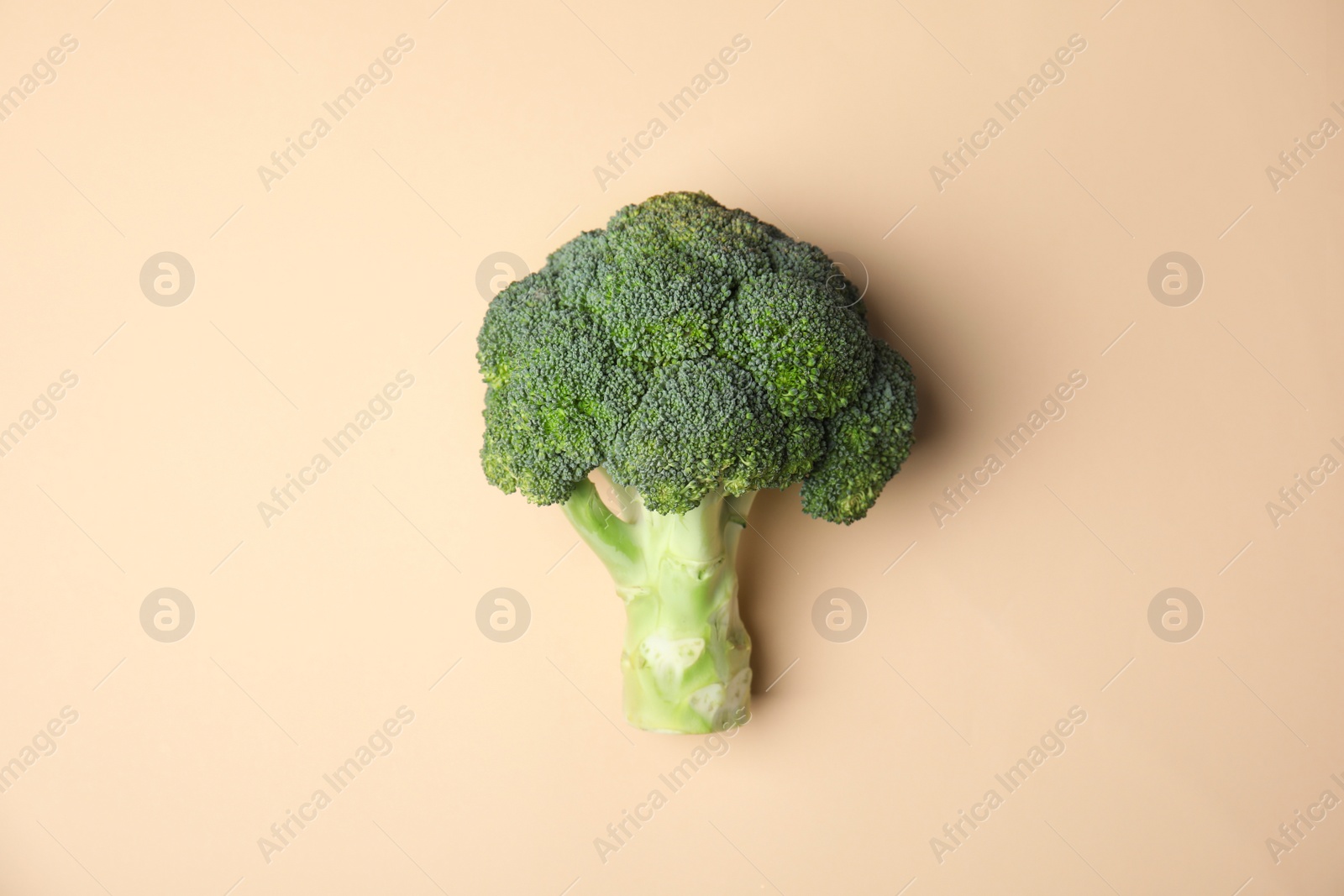 Photo of Fresh green broccoli on color background, top view. Organic food