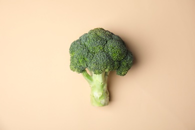 Photo of Fresh green broccoli on color background, top view. Organic food