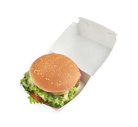 Photo of Delicious burger with beef patty and lettuce in box isolated on white