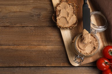 Delicious meat pate, fresh bread and cherry tomatoes on wooden table, flat lay. Space for text