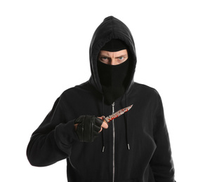 Man in mask with bloody knife on white background. Dangerous criminal