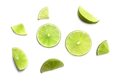 Photo of Fresh ripe limes on white background, top view