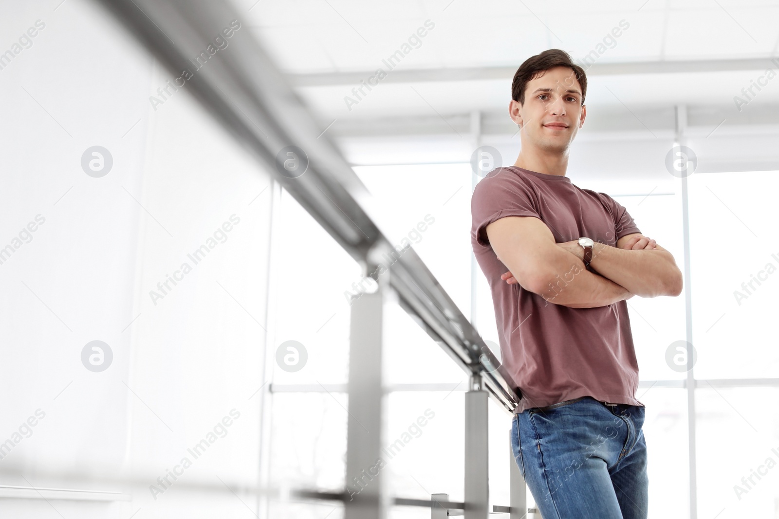 Photo of Portrait of confident young man, indoors