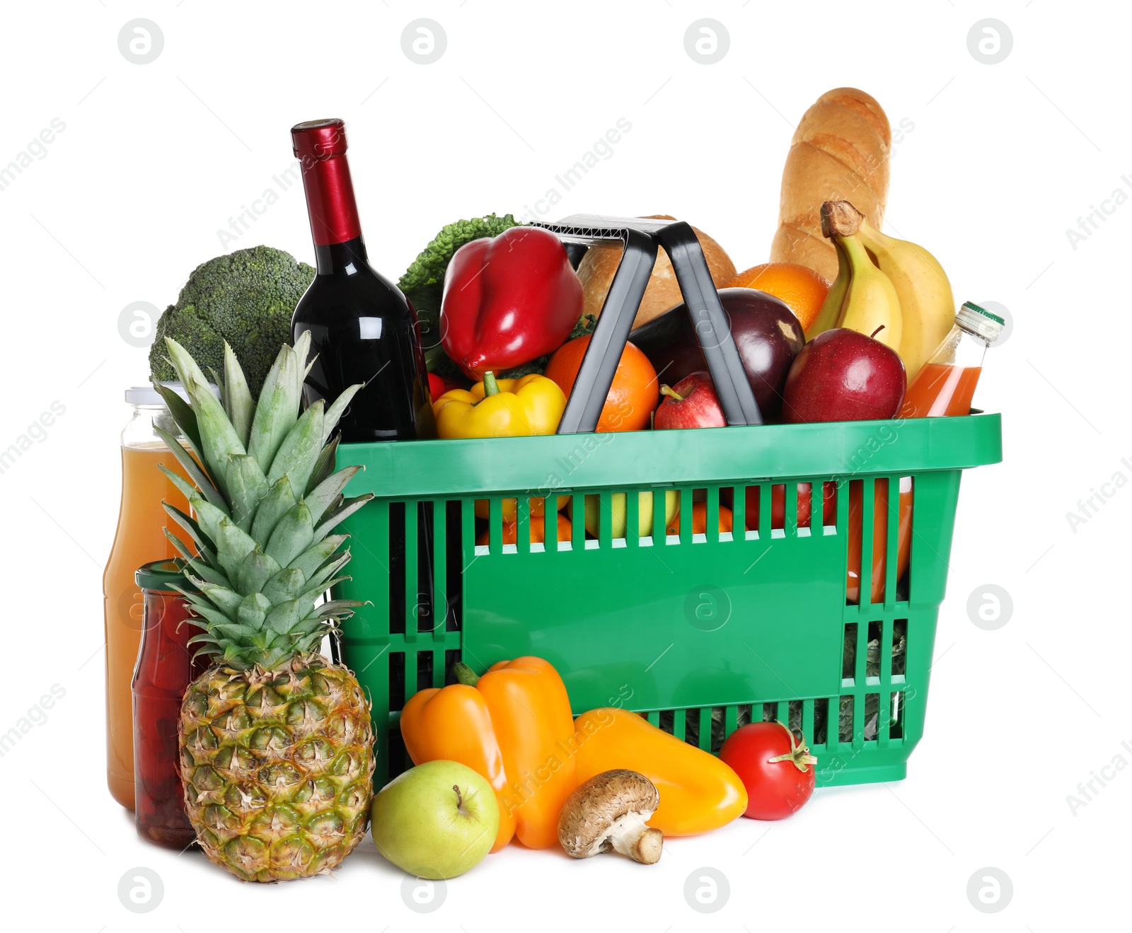 Photo of Shopping basket and grocery products on white background