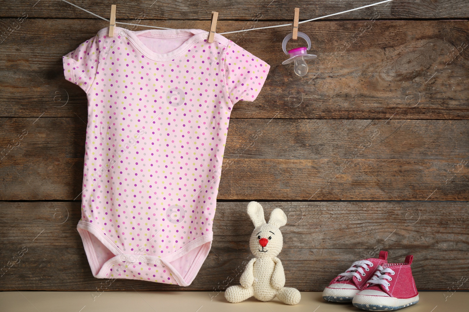 Photo of Composition with baby accessories on wooden background