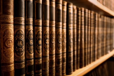 Image of Collection of old books on shelf in library, closeup