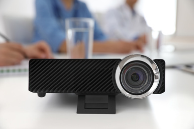 Video projector on table during medical conference, closeup