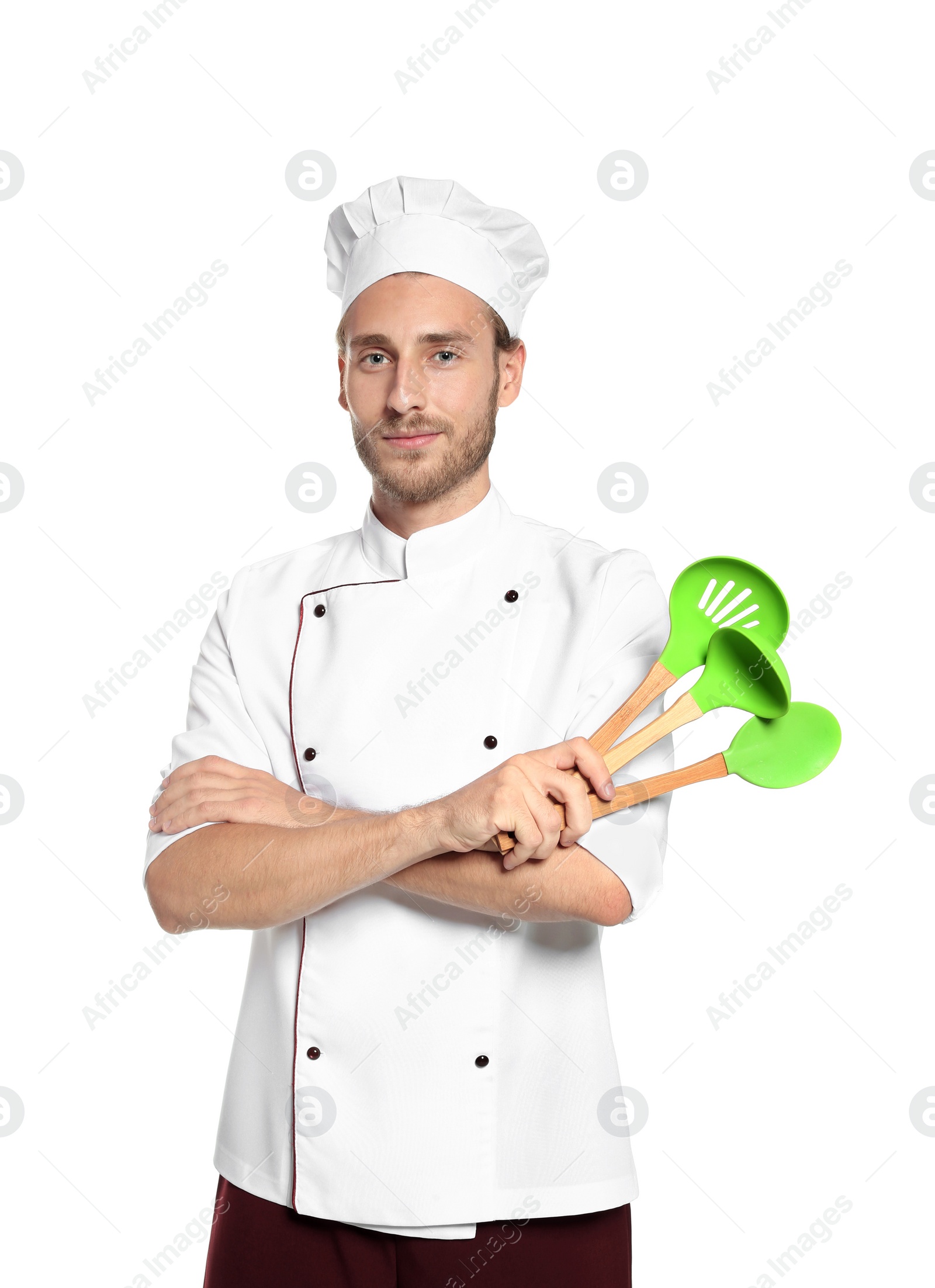 Photo of Professional chef with kitchen tools on white background