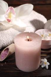 Composition with spa supplies and flowers on wooden table