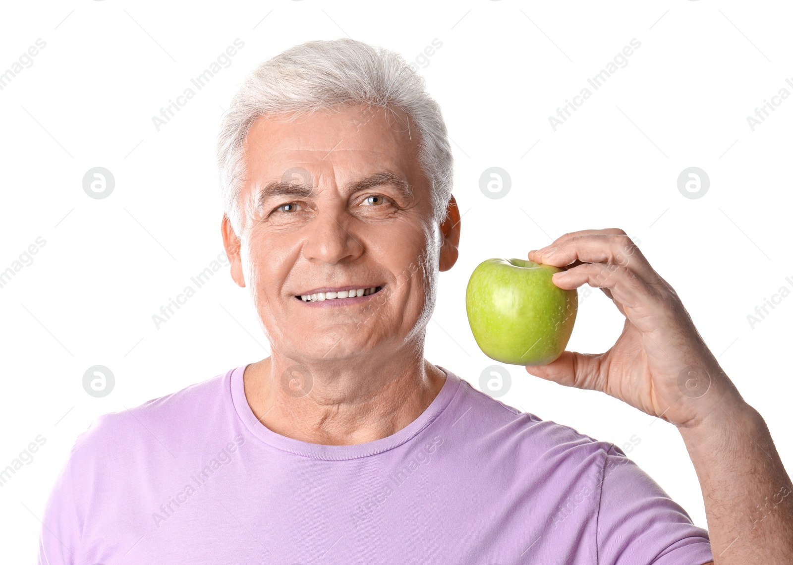 Photo of Mature man with healthy teeth and apple on white background