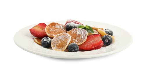 Photo of Plate with cereal pancakes and berries isolated on white