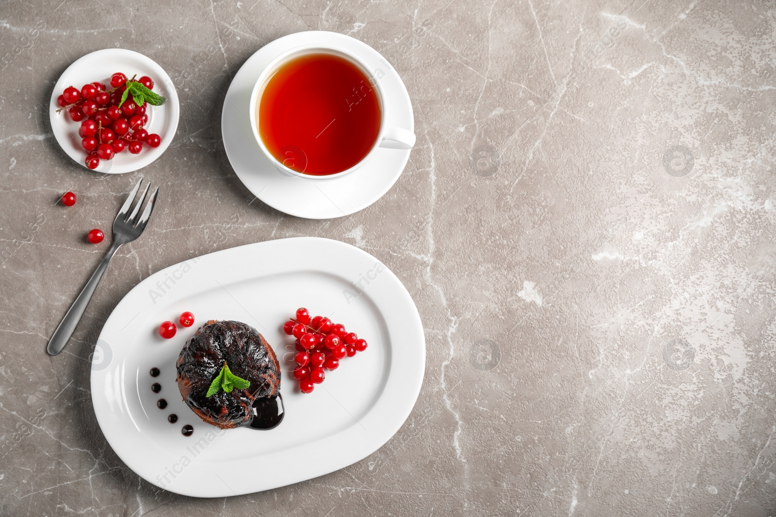 Photo of Delicious warm chocolate lava cake on marble table, flat lay. Space for text