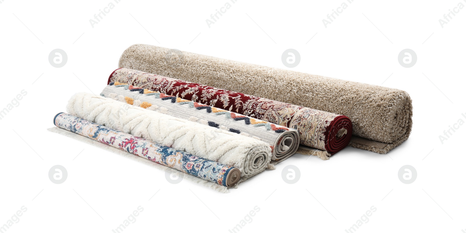 Photo of Rolled carpets on white background. Interior element