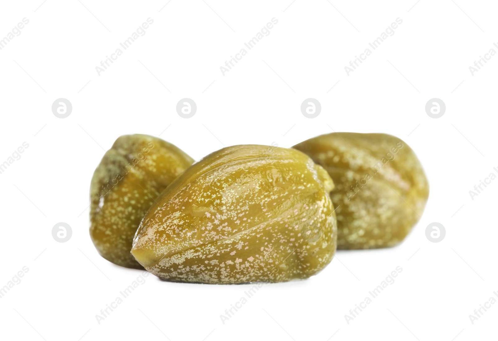 Photo of Three delicious pickled capers on white background