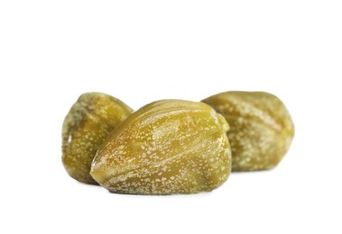 Photo of Three delicious pickled capers on white background