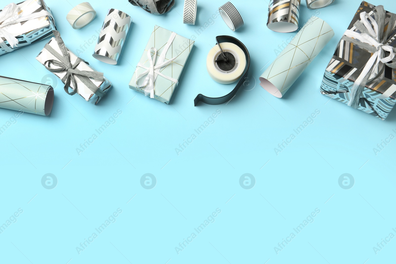 Photo of Flat lay composition with beautiful gift boxes and space for text on color background