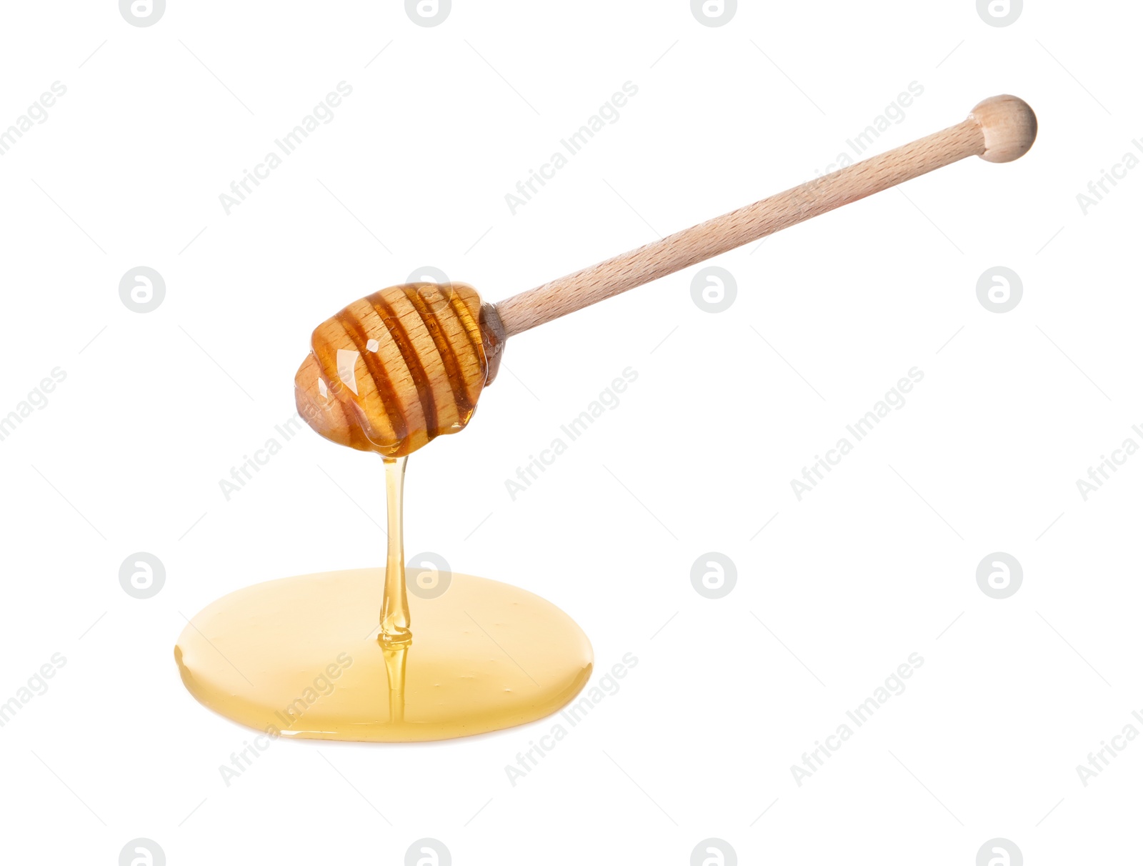 Photo of Fresh honey dripping from dipper on white background