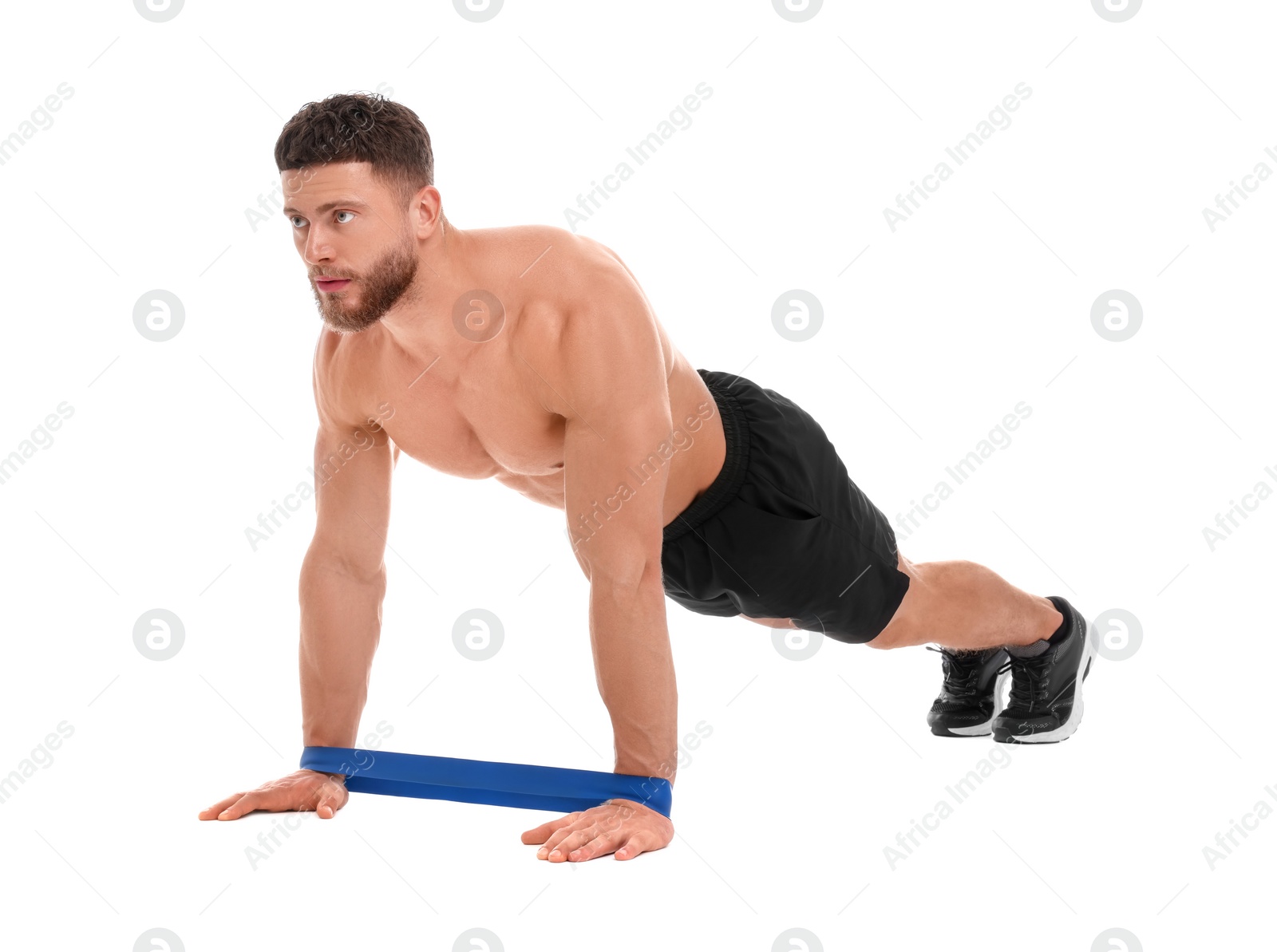 Photo of Young man exercising with elastic resistance band on white background