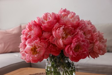 Beautiful pink peonies in vase indoors. Interior design