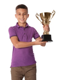 Photo of Happy boy with golden winning cup on white background