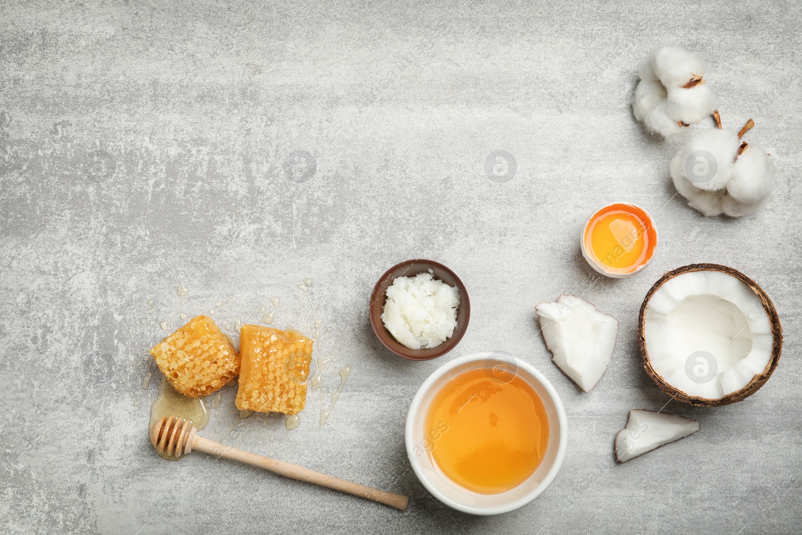 Photo of Fresh ingredients for homemade effective acne remedies on grey background, flat lay